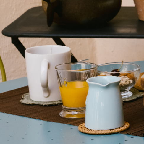 Close-up of the embossed bee detail on the La Rochère ceramic creamer