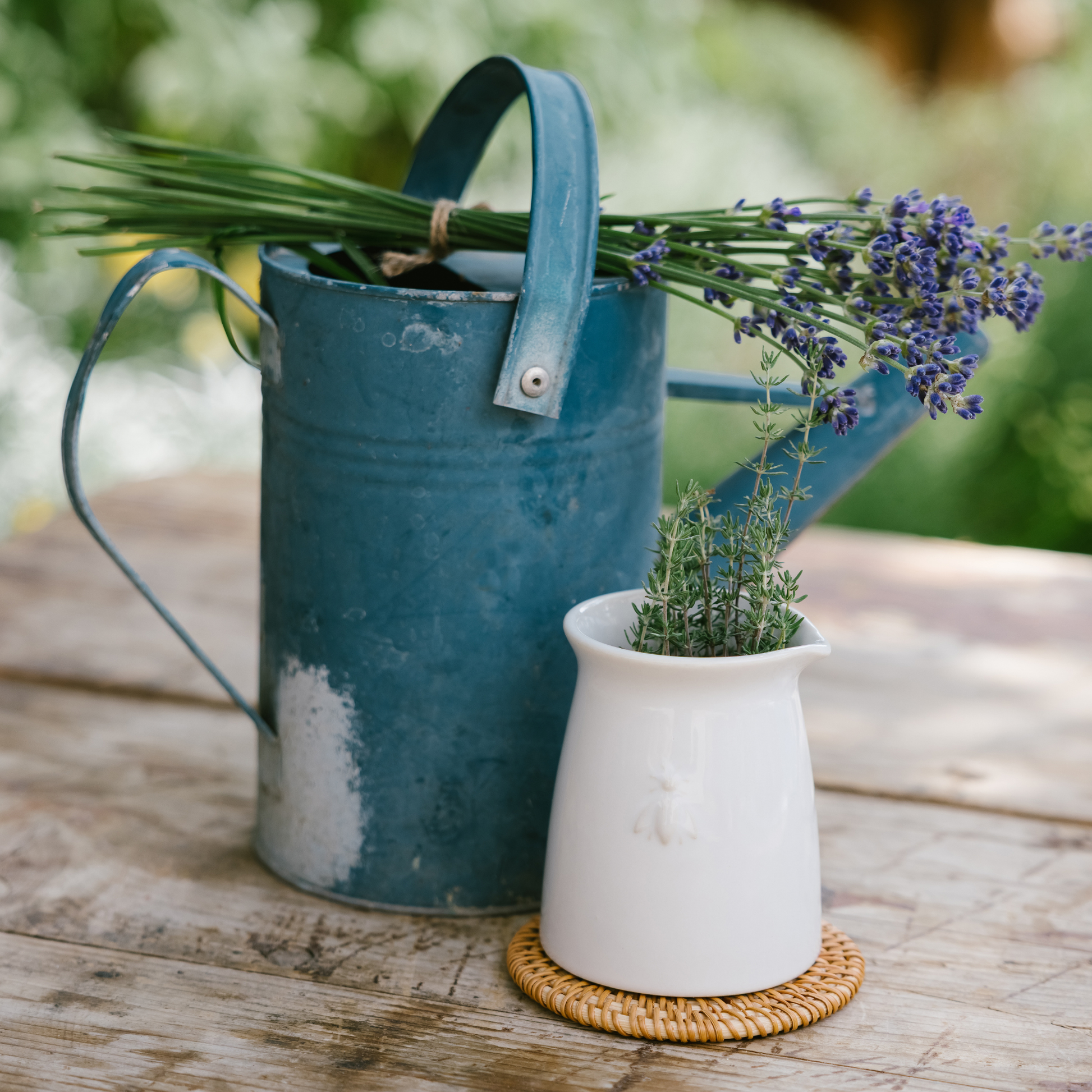 La Rochère Bee ceramic creamer styled on a French country breakfast table