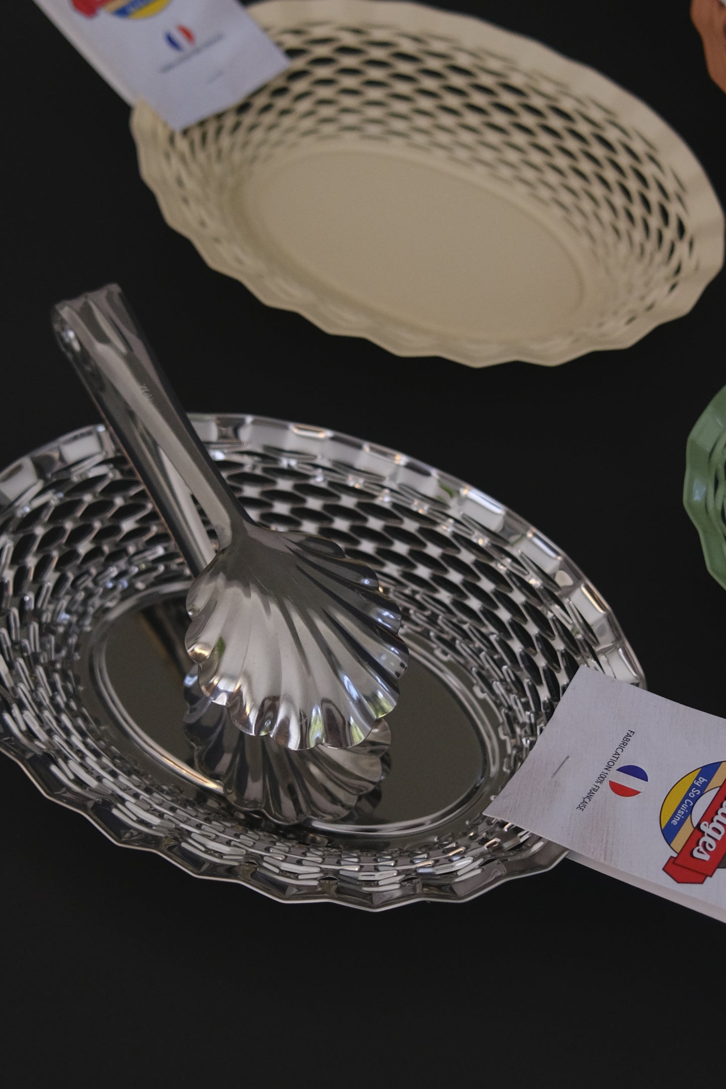 Oval stainless steel bread basket Roger Orfevre in use at dining table