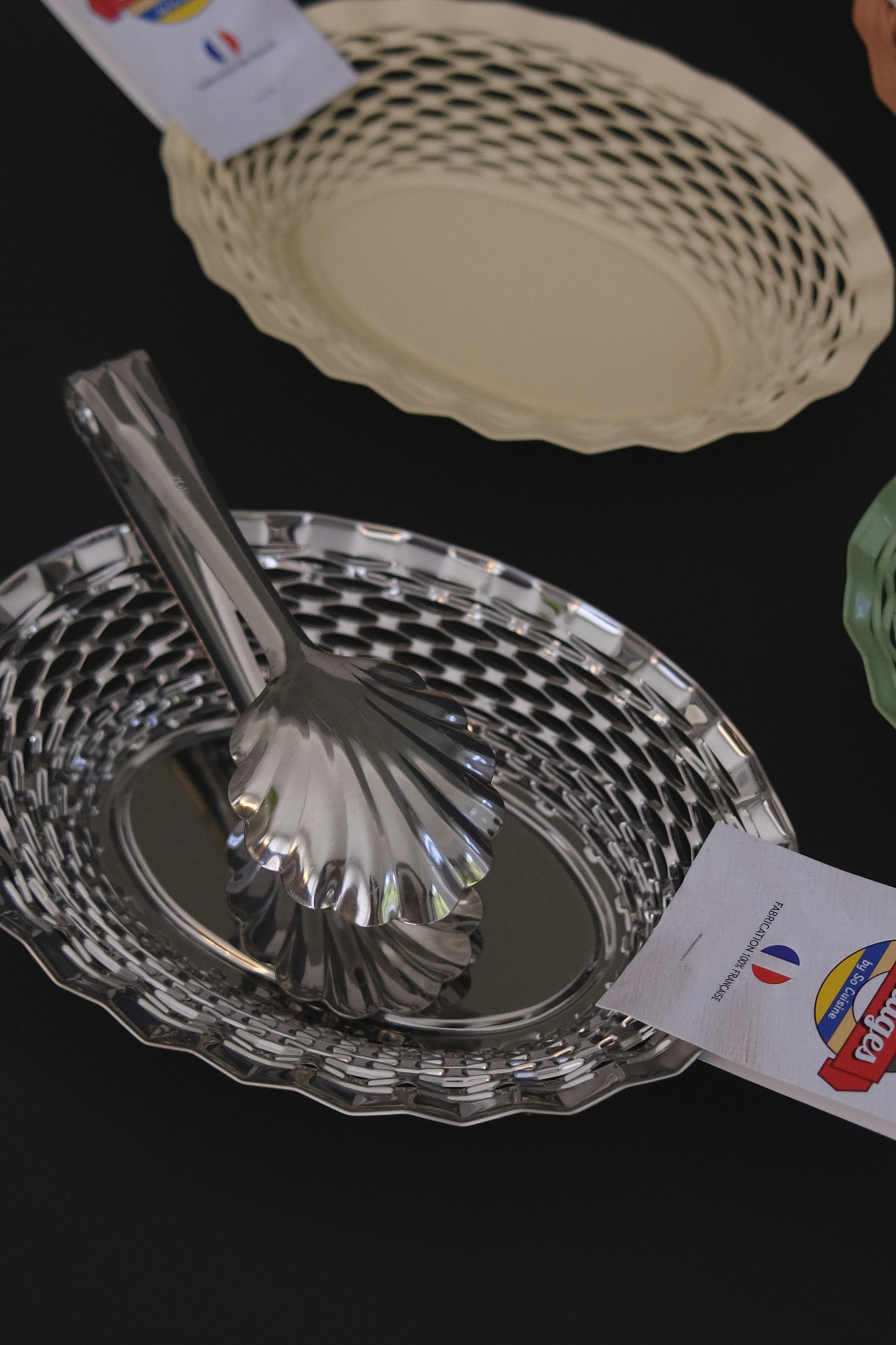 Oval stainless steel bread basket Roger Orfevre in use at dining table