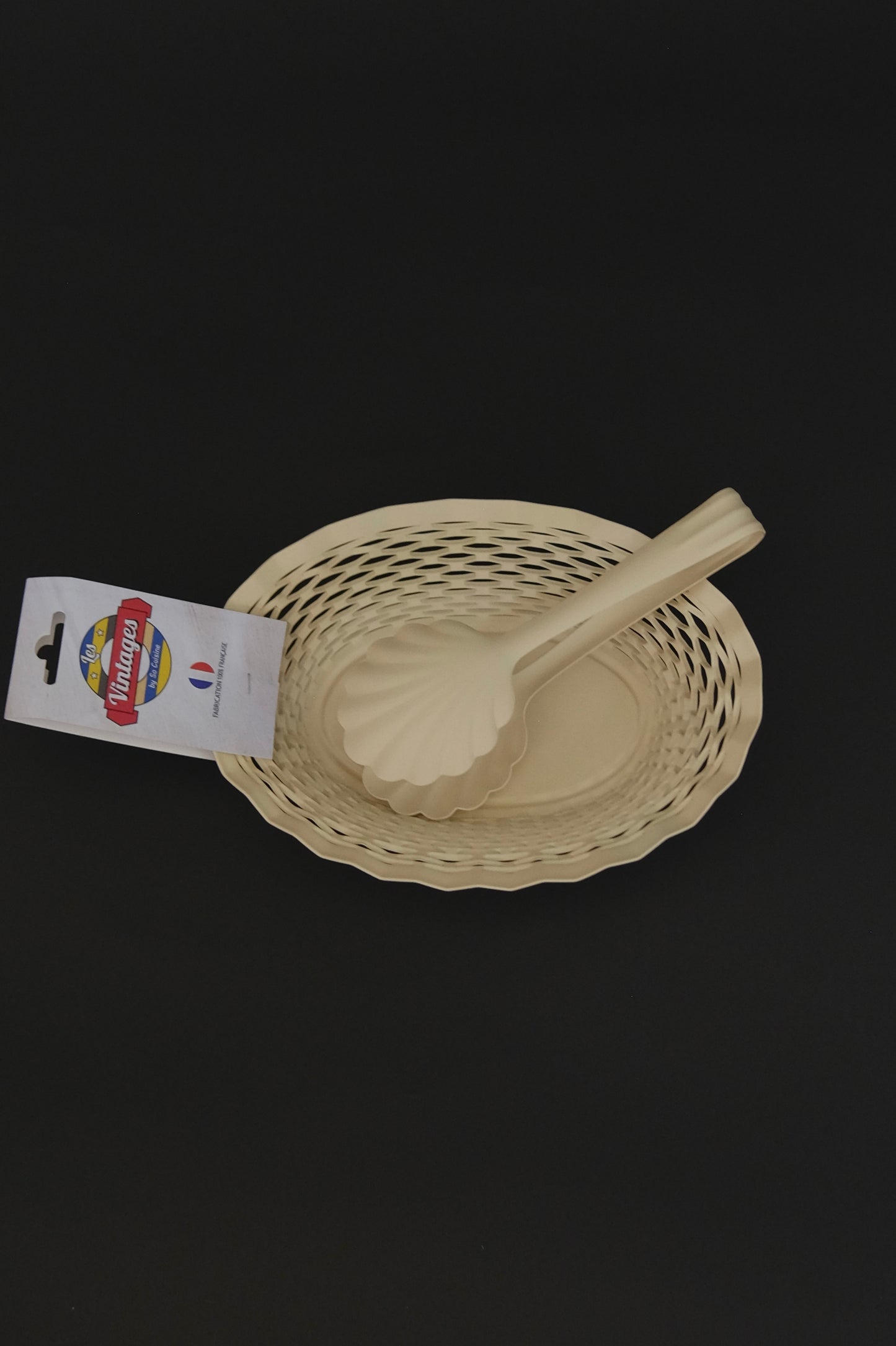 Roger Orfevre cream bread tong styled with bread basket on table