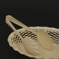Roger Orfevre vanilla bread basket with rolls at dining table
