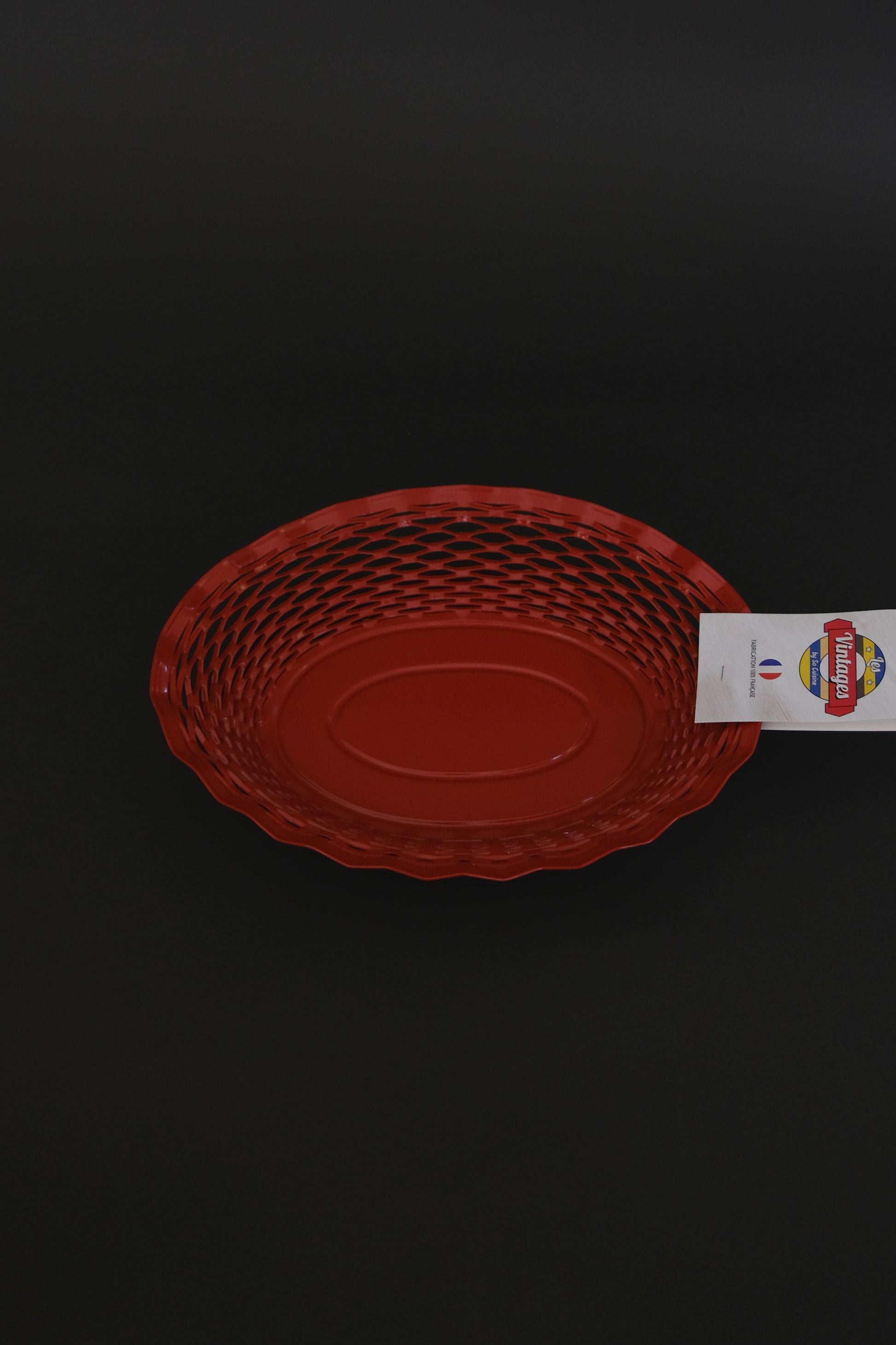 Roger Orfevre red bread basket overhead view artisan tableware