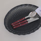 Small and large matte black woven bread baskets