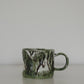Close-up of matcha green mug rim and glaze texture