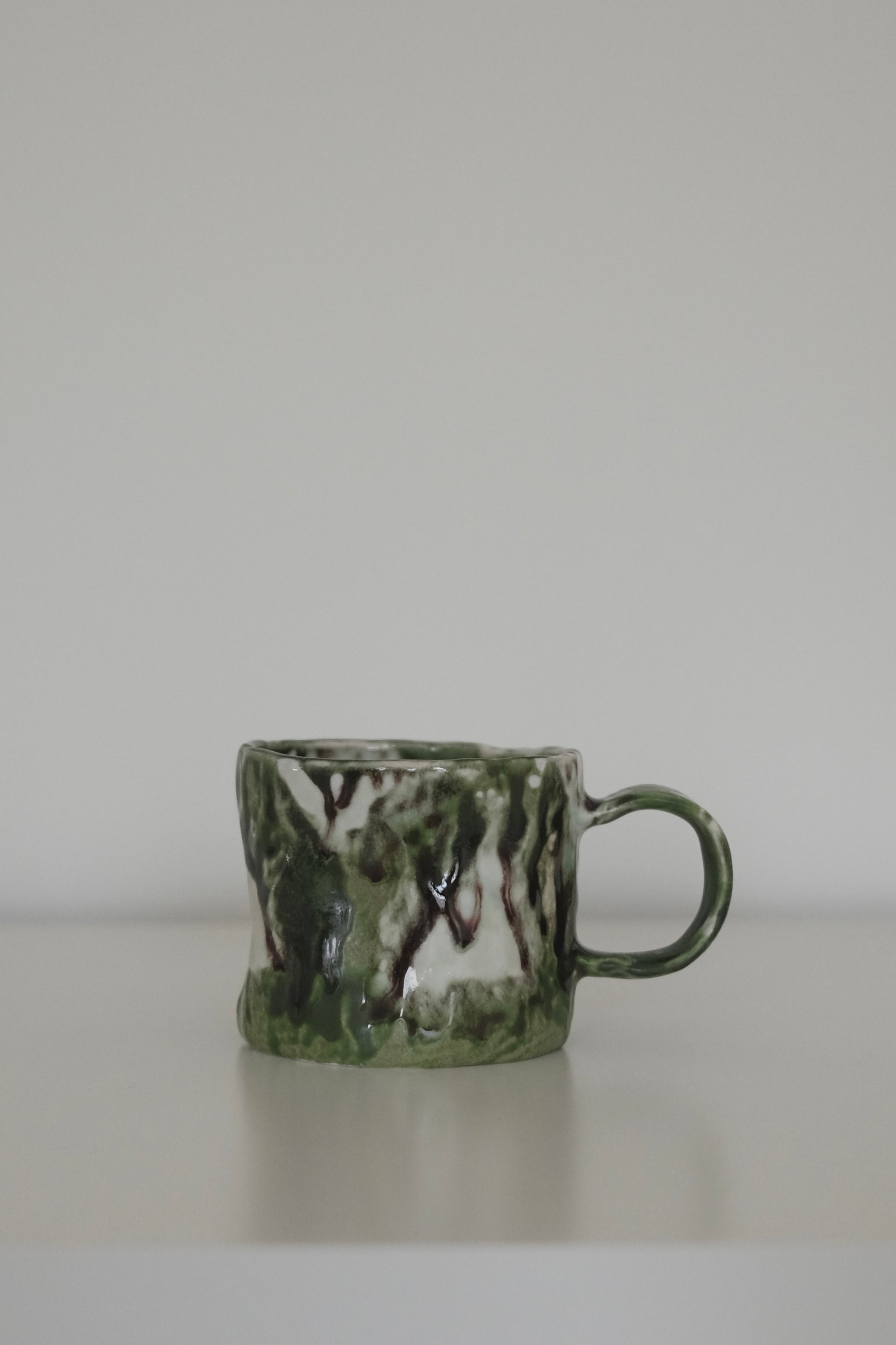 Close-up of matcha green mug rim and glaze texture