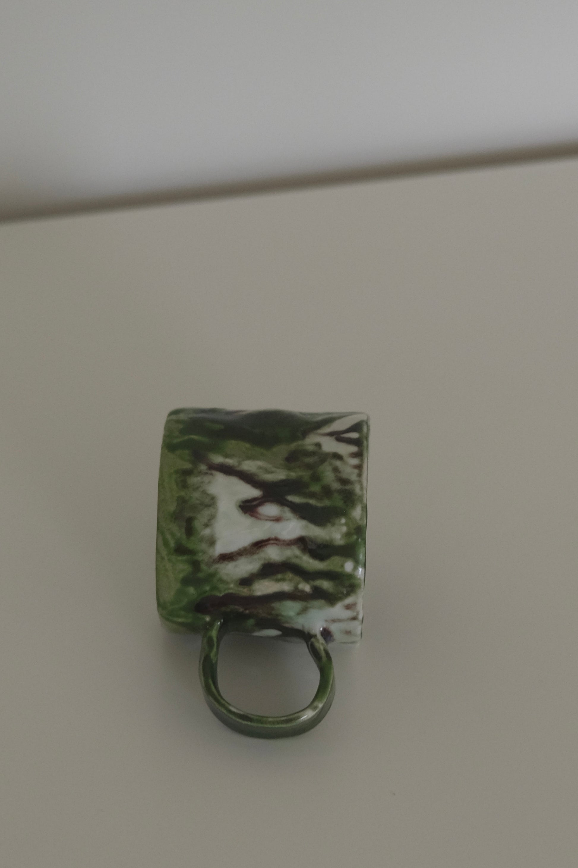 Matcha ceramic mug shown at an angle to show shape