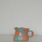 Ruffle Rim Mug in Blood Orange & Lime shown from a side angle
