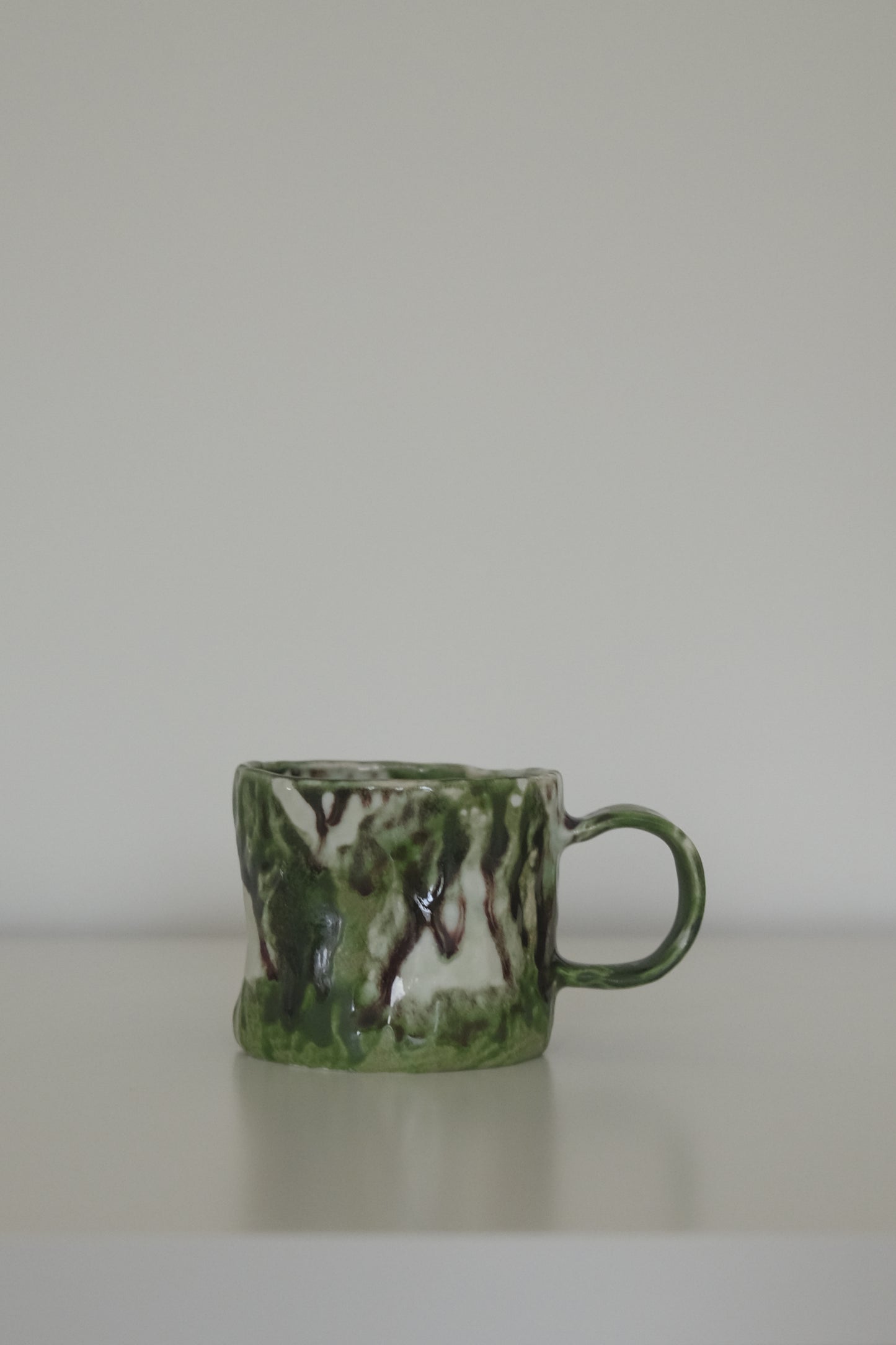 Matcha green ceramic coffee mug from HAUS HAUS on white background