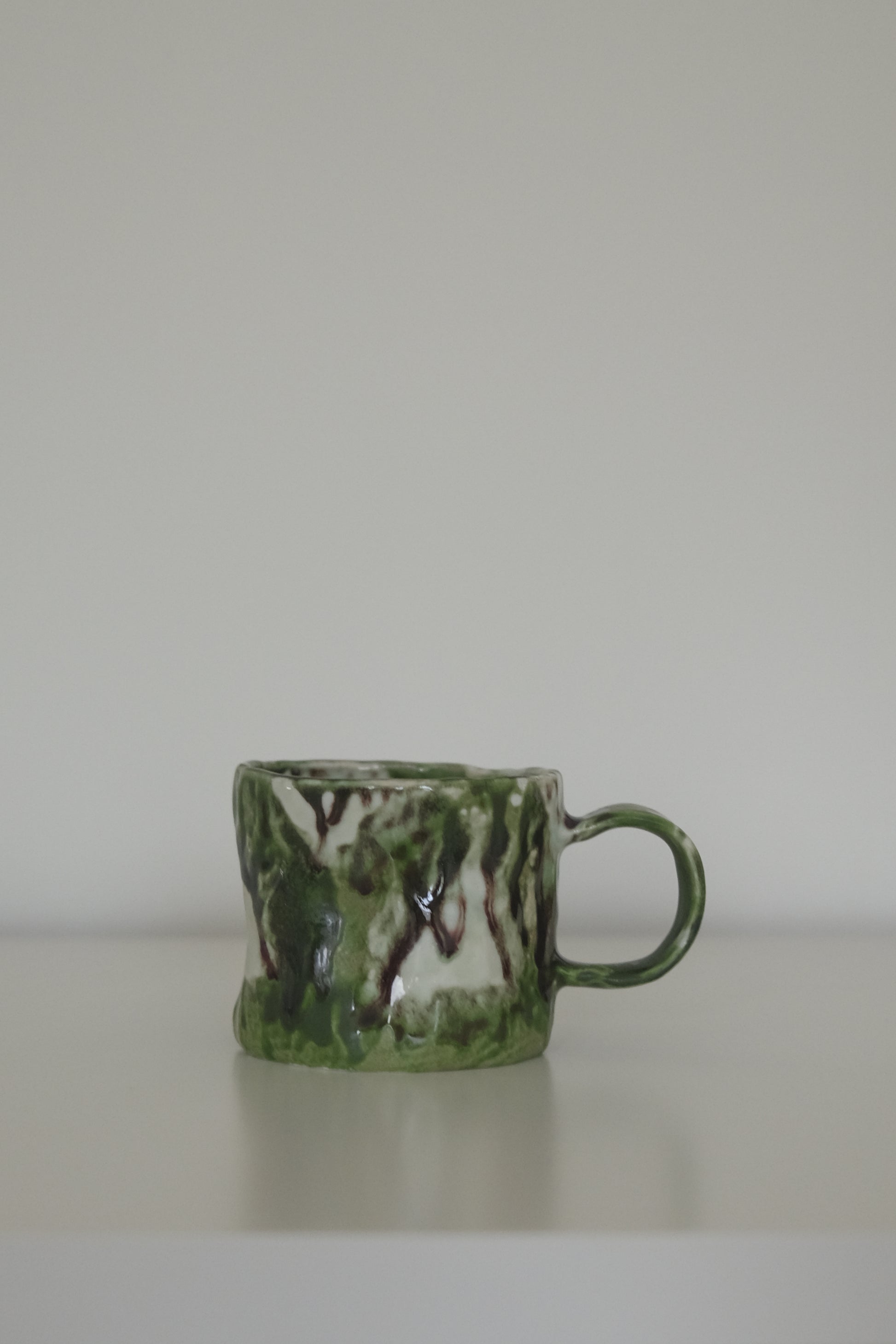 Matcha green ceramic coffee mug from HAUS HAUS on white background