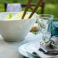 La Rochère Bee serving bowl filled with salad on a table